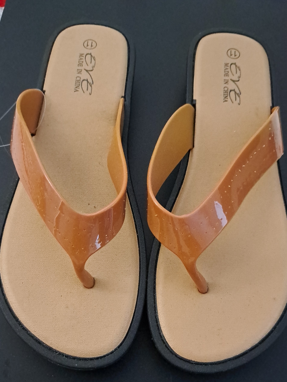 Eve Women’s Tan Patent Strap Flip Flop Sandals